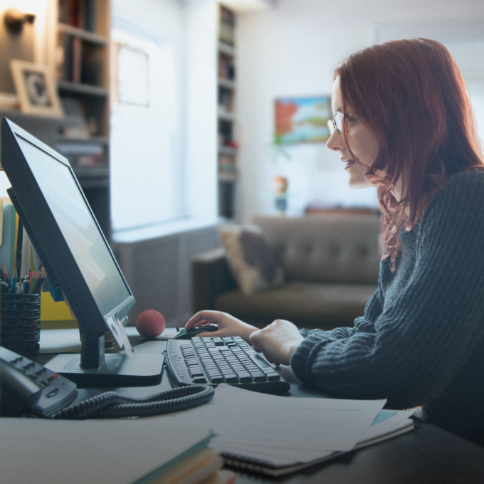 Woman looking at a desktop screen