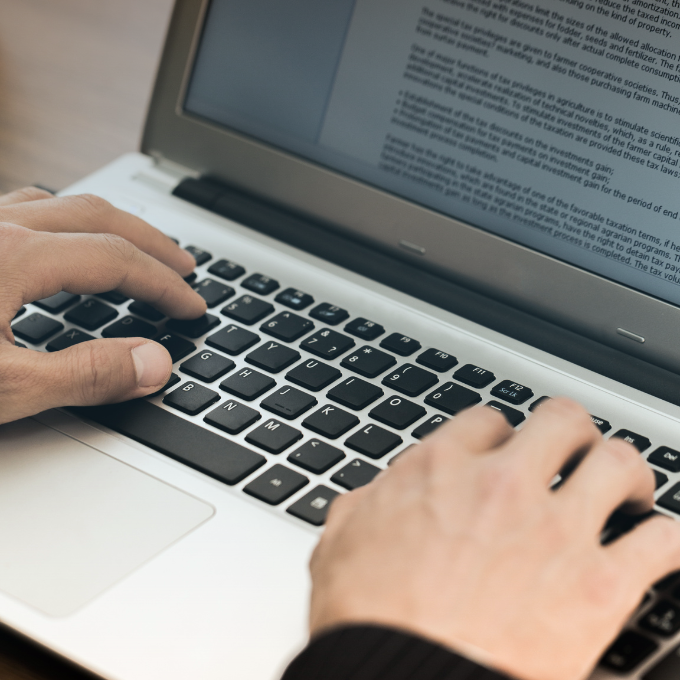 Person typing on a laptop