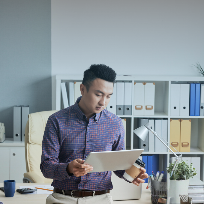 Person looking at a tablet in an office setting